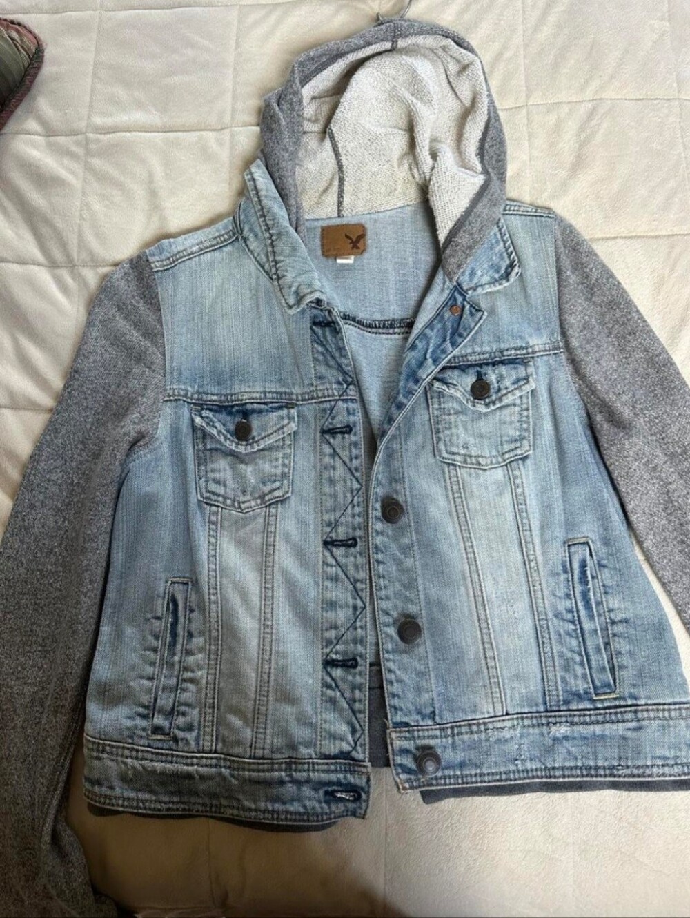 American Eagle denim jacket with gray hoodie